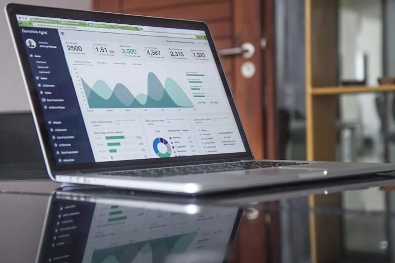 Business professional reviewing IT budget spreadsheet and technology spending plan for a small company