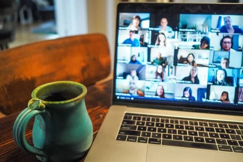 Remote worker on a laptop connected to a business VPN for secure office access and network performance from home