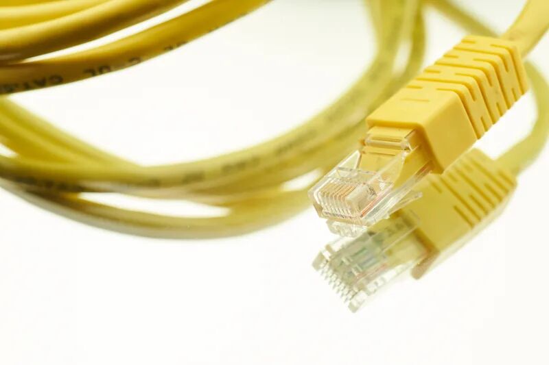 Yellow Ethernet network cables, representing small business next-generation firewall protection and network security
