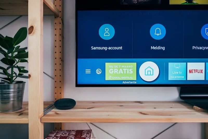 Flat screen TV mounted on a living room wall with hidden cable management showing professional TV installation